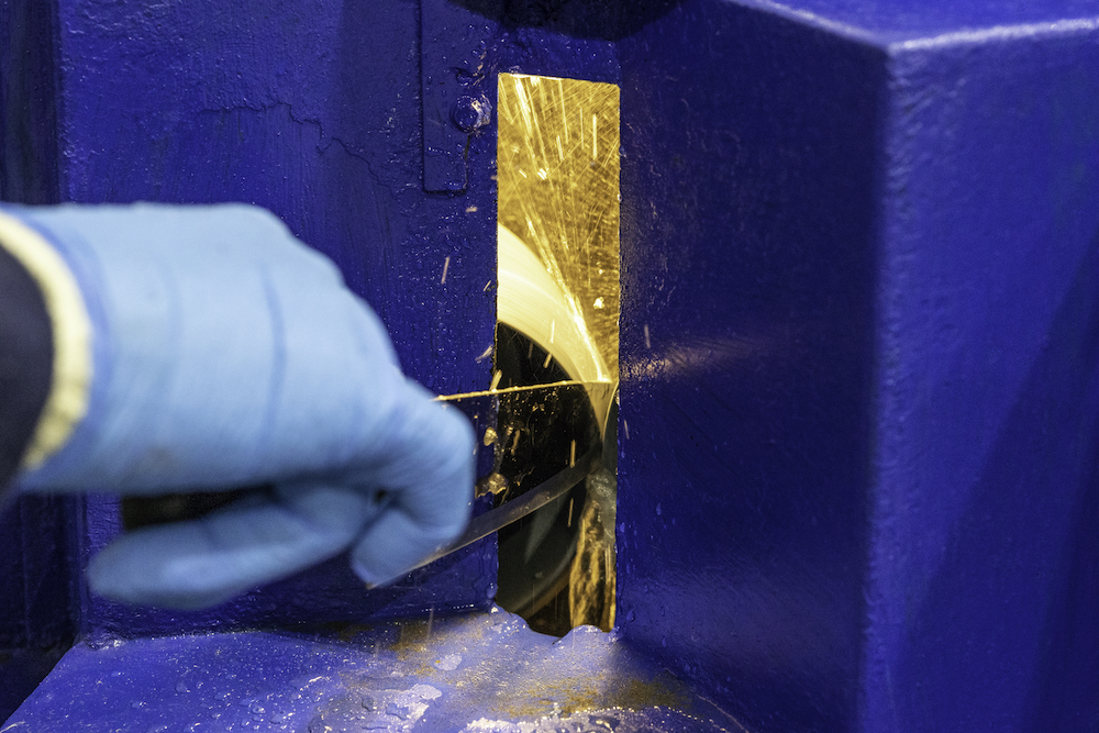 knife being professionally sharpened