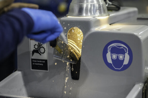 knife being professionally sharpened