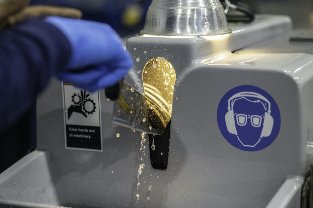 knife being professionally sharpened